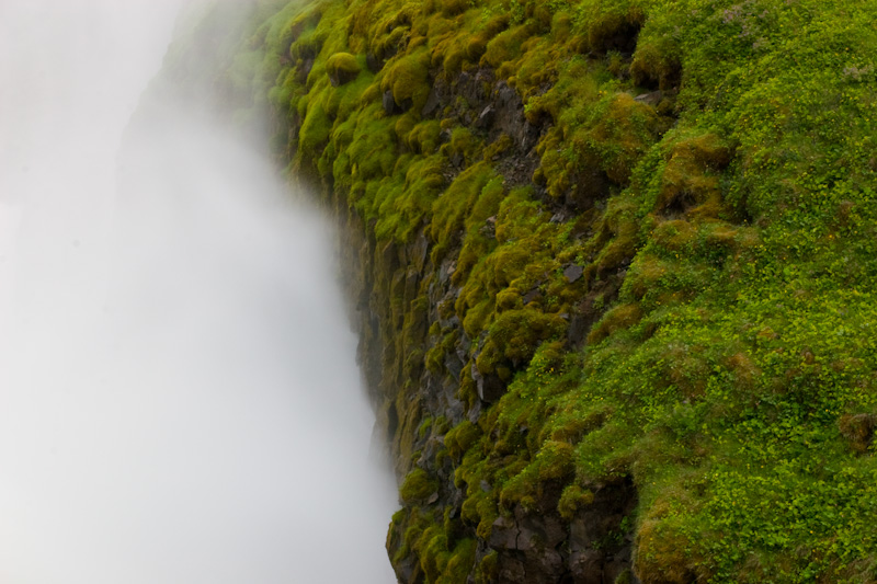 Spray From Gullfoss On Moss Covered Canyon Wall